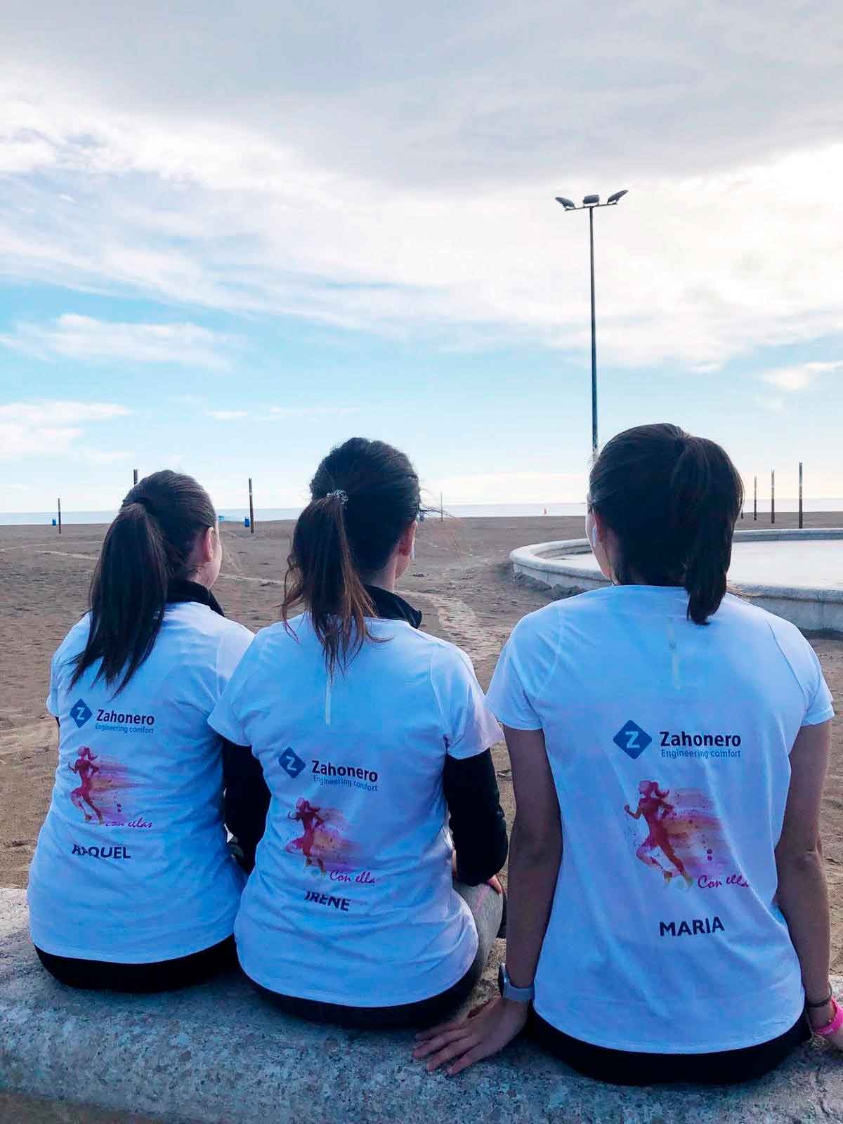 Zahonero team members wearing Engineering comfort shirts at the beach